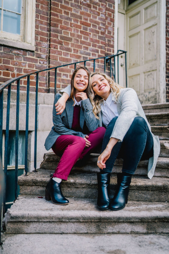 Anna and Celine sitting on stairs in downtown knoxville for novelbound podcast branding shoot